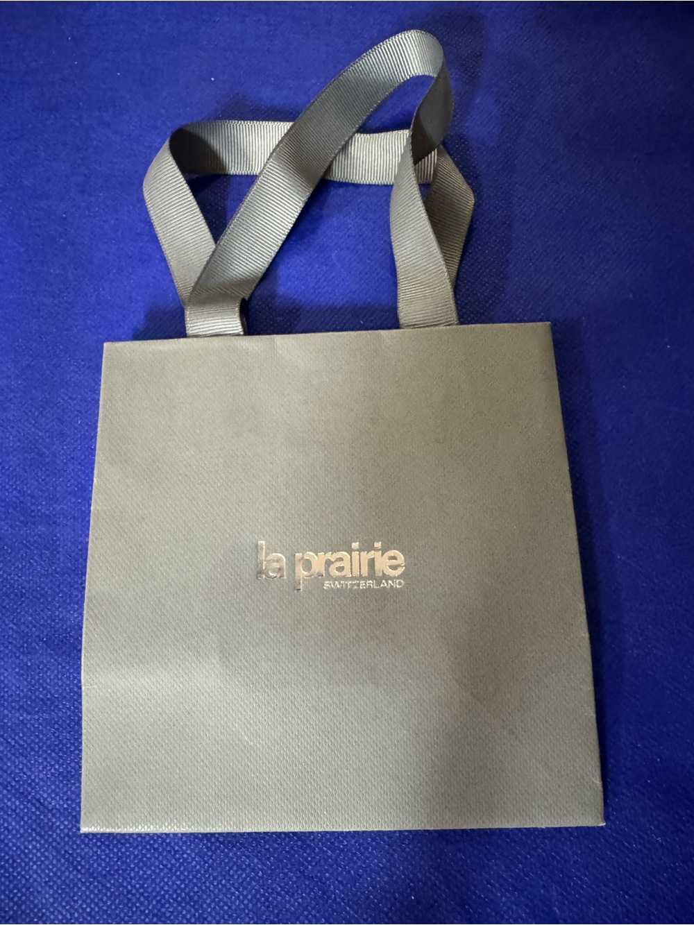 La Prairie 💯% Authentic Gray Shopping Gift Bag with Gold Logo and Ribbon Handles